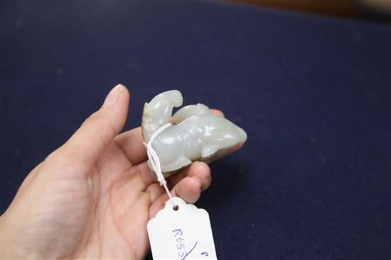 A Chinese pale celadon and russet jade group of two horses, length 6cm